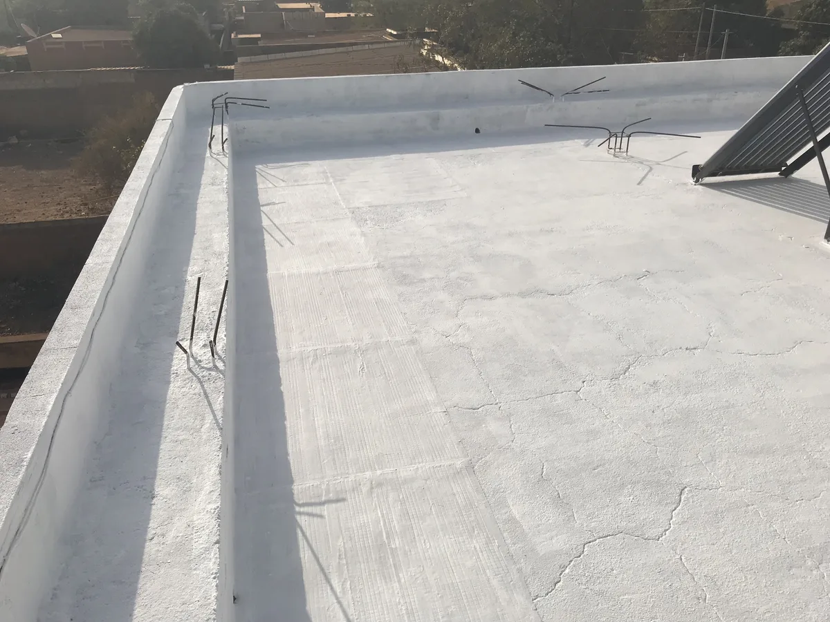 After ThermBlock treatment: Concrete terrace: the porous, soiled slab becomes a continuous white membrane