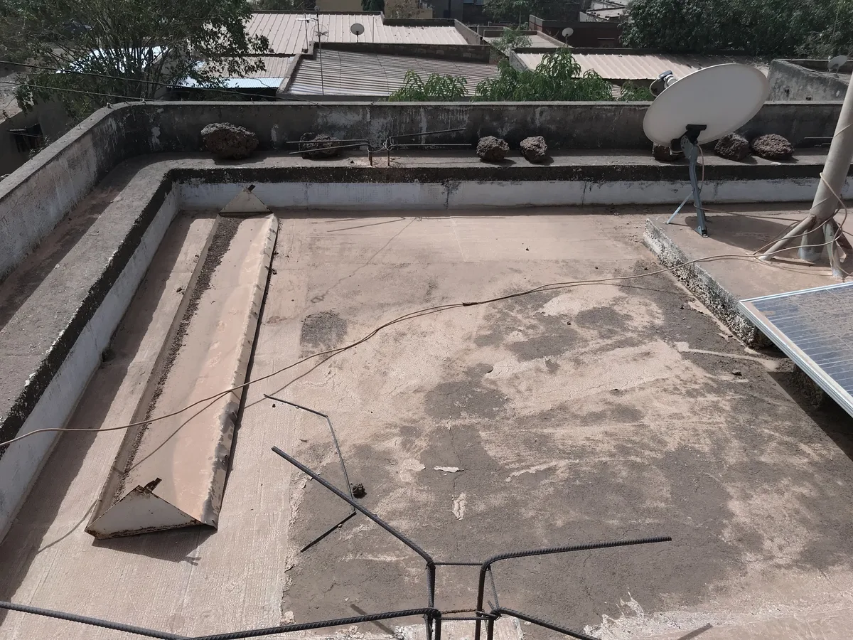 Before treatment: Concrete terrace: the porous, soiled slab becomes a continuous white membrane